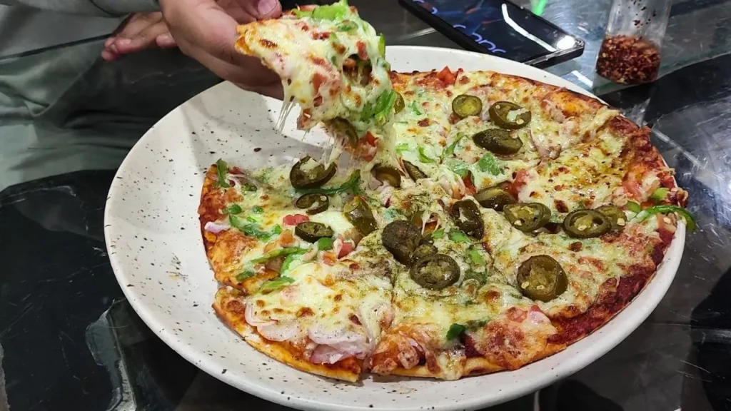 famous wood fired pizza in mapro garden in mahabaleshwar