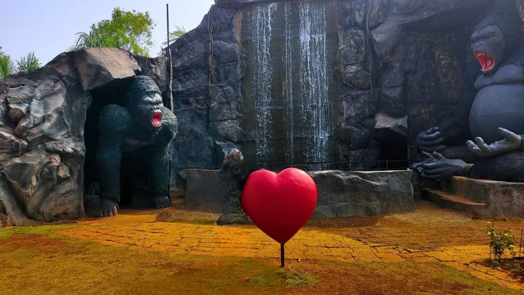 waterfall with monkey at kingsberry in mahabaleshwar